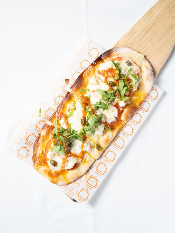 Chalana de langostinos con alcaparras y tomate seco